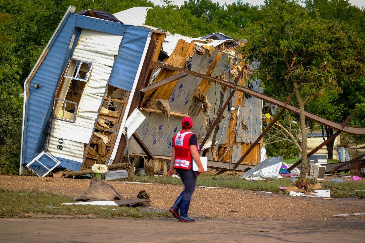 Red Cross volunteer surveying hurricane damage