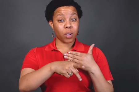 A Red Cross volunteer using American Sign Language