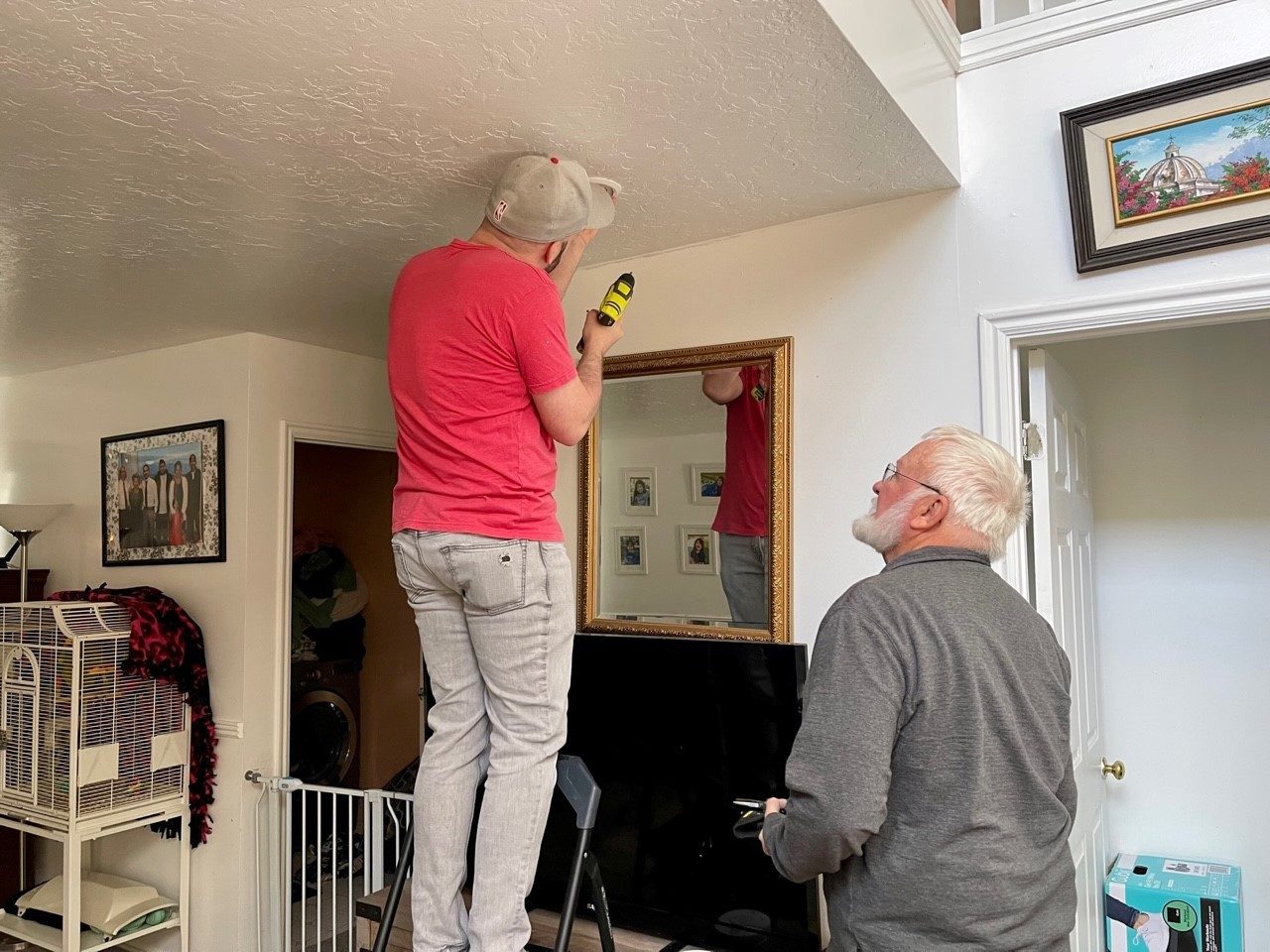 Volunteer installing a smoke alarm