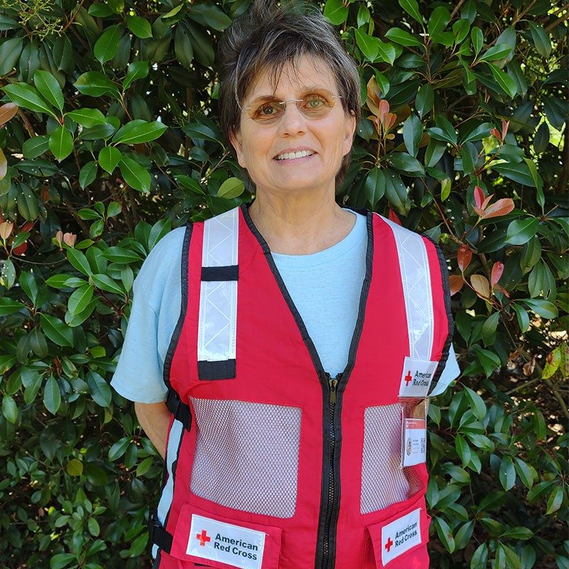Terry Hevener in Red Cross vest smiling for camera