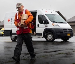 volunteer delivering emergency supplies