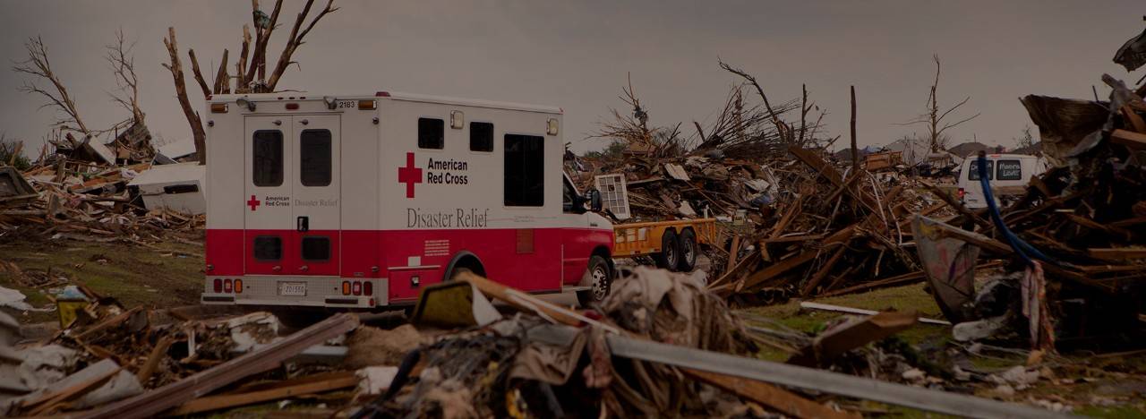 May 24, 2013. Moore, Oklahoma. One of 41 American Red Cross emergency response vehicles roams through a neighborhood affected by the storm. The Red Cross volunteers deliver food, water, and relief supplies to residents in need of resources. Photo by Talia Frenkel/American Red Cross