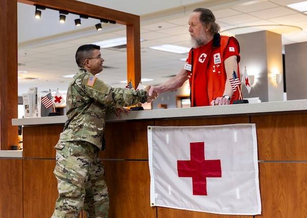 American Red Cross volunteer Bill Mullikin greets and assists active-duty service members, veterans and their families who come to the Reynolds Health Clinic at Fort Sill for care.