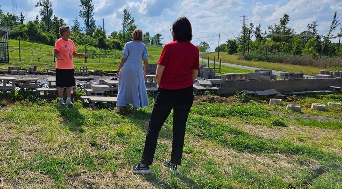 Clara Rice went through terrible losses when tornadoes destroyed her Kentucky home twice in just three years. Here she walks her property with Red Cross representatives