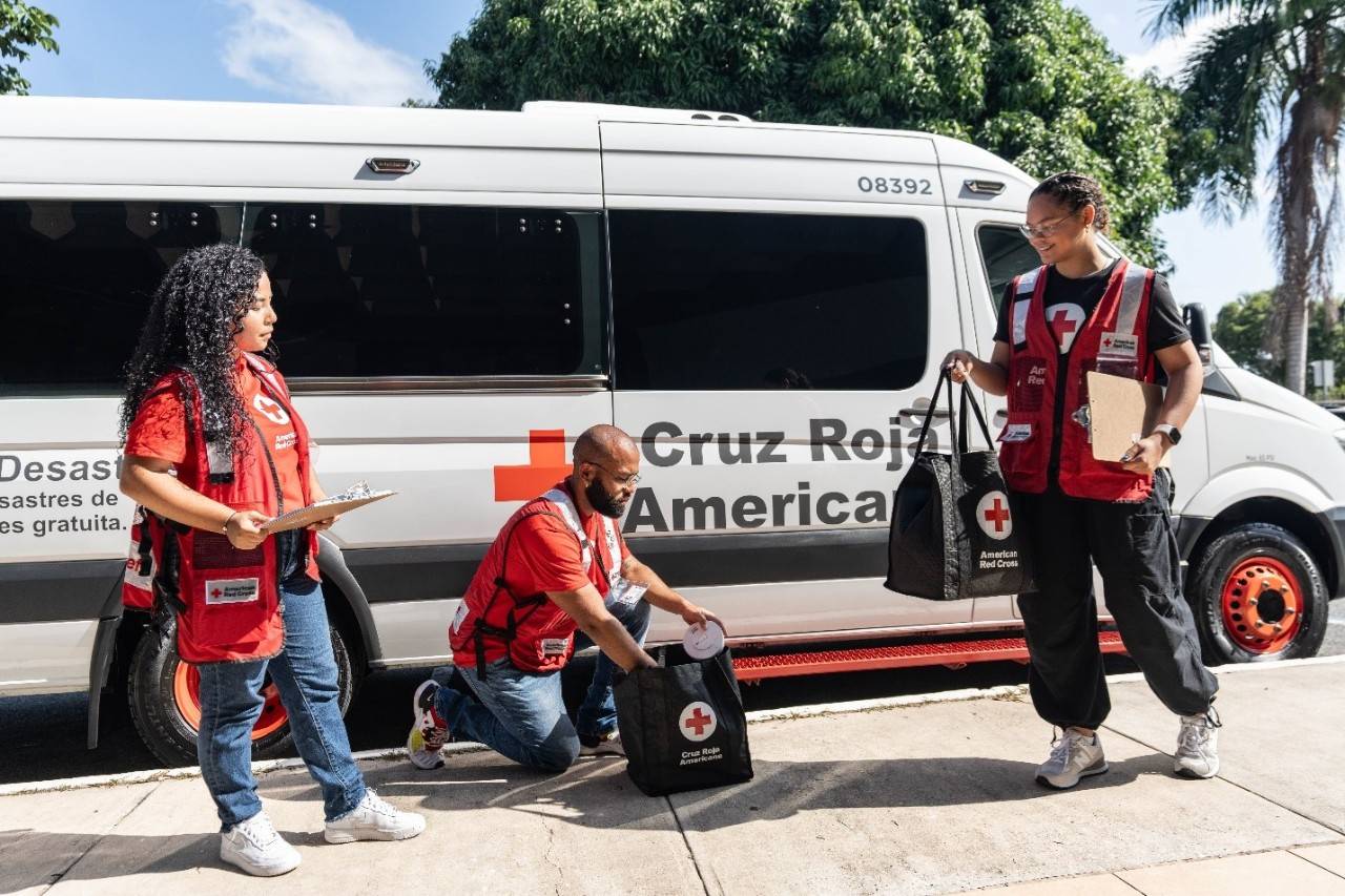 Red Cross volunteers getting ready to deliver disaster relief supplies 