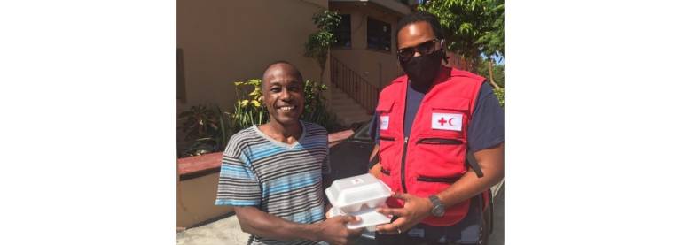 Bahamas Red Cross volunteer Khris delivers lunch