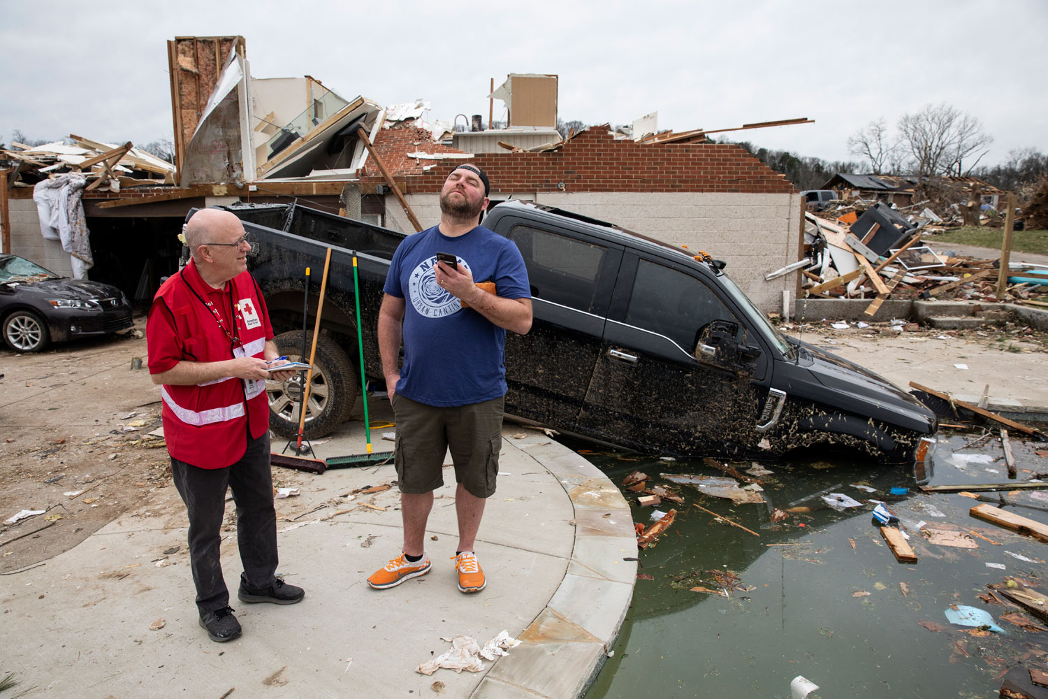 Red Cross volunteer Doug Bardwell discuss the loss of Bailey’s two cars
