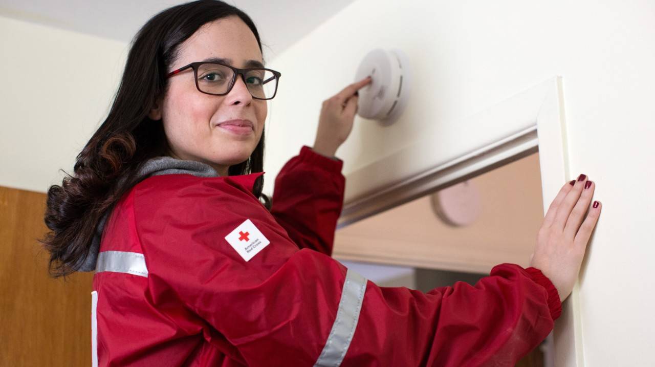 March 24, 2018. 
Smoke Alarm Installation, Sound the Alarm Campaign.
Long Island, New York.
Pictured: American Red Cross volunteer, Carla Cruz.

American Red Cross volunteer Carla Cruz installs a smoke alarm in a home in Long Island, New York. The smoke alarms are installed, free of charge, by American Red Cross volunteers across the country as part of a national home fire education and prevention campaign called "Sound the Alarm."

Photo by Marko Kokic for the American Red Cross