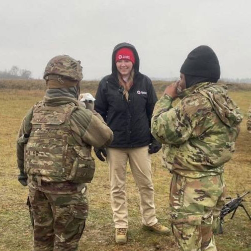 Jill Eaves, SAF regional program manager for the Red Cross Missouri-Arkansas Region, talks to American troops at a NATO training site in Poland where she was deployed. 