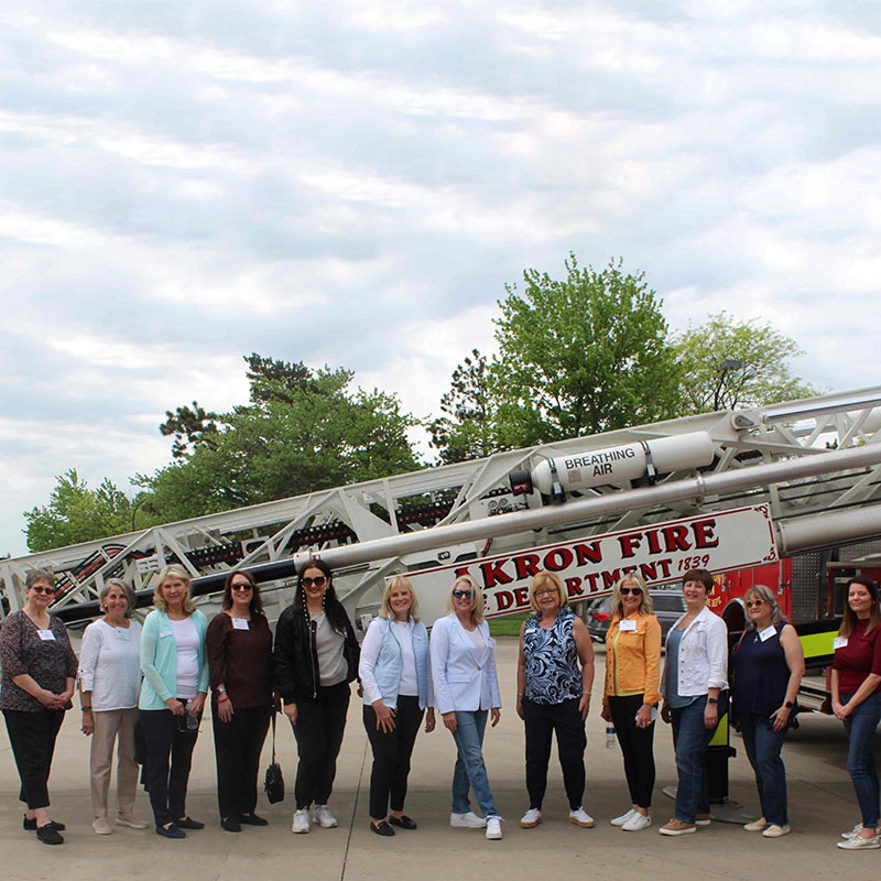 Group shot of Tiffany Circle members at Akron Fire Department.