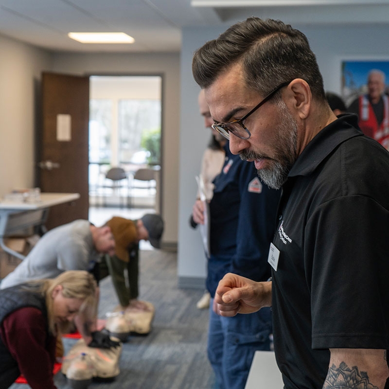 Red Cross CPR instructor teaching a class.