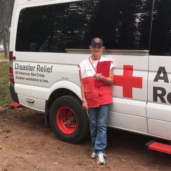 sherrilyn hamilton is front of disaster relief vehicle