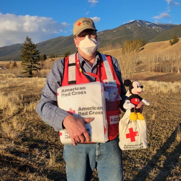 scott fairfield holding red cross blanket and supplies