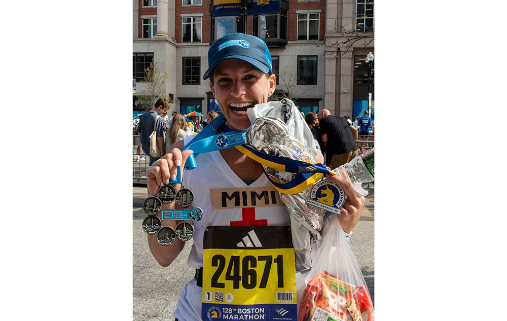 Marathon runner showing medals