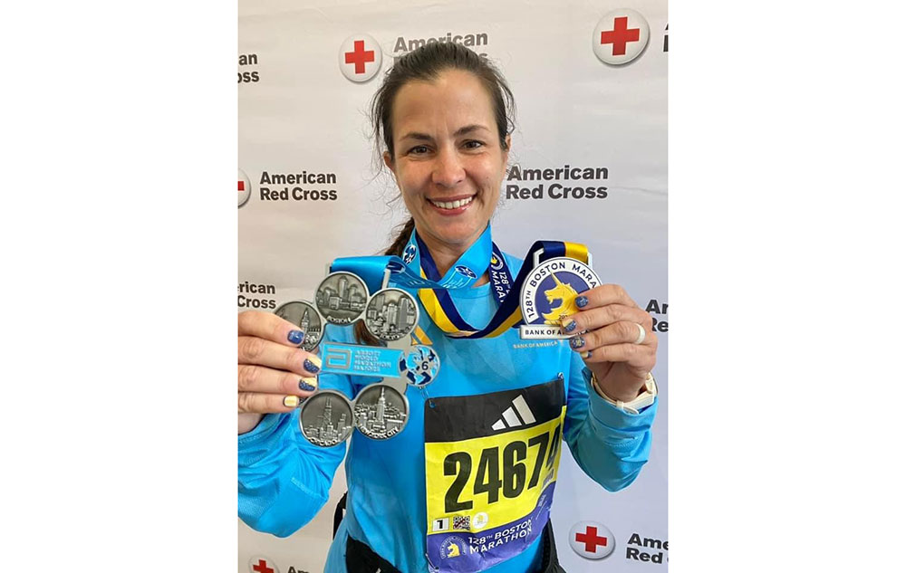 Marathon runner showing medals