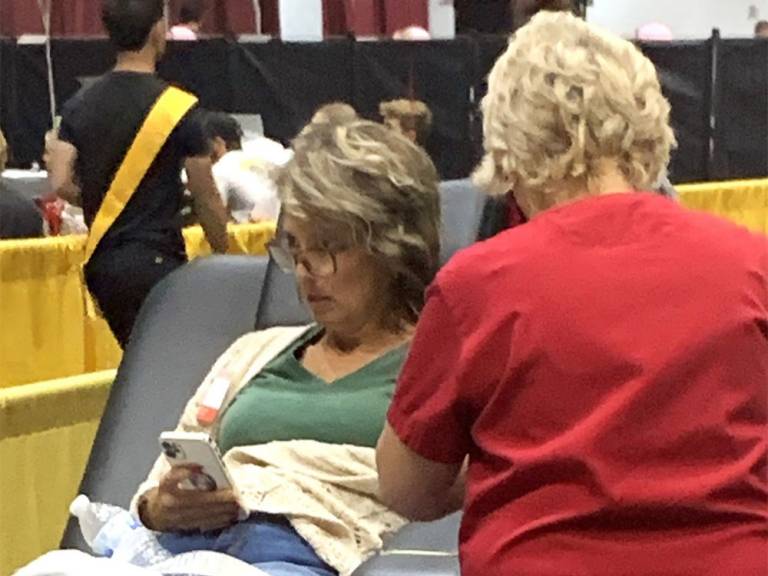 Lori Imhoff in cot donating blood
