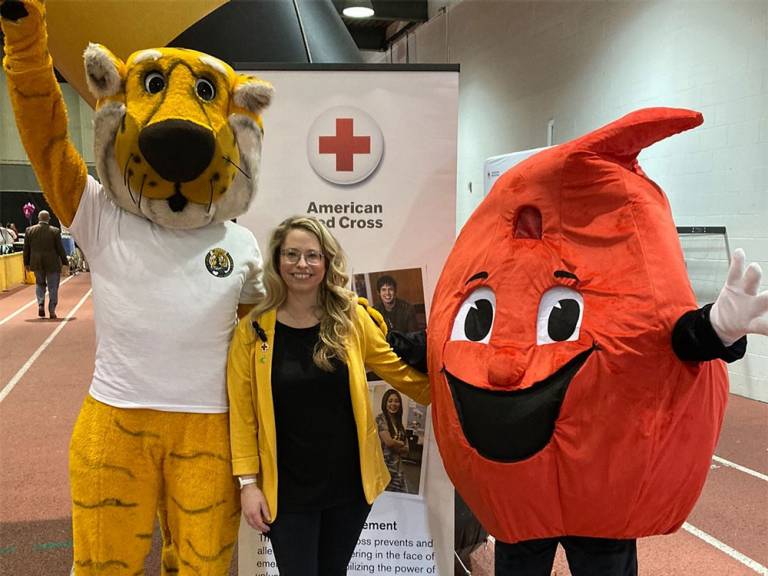 Rebecca Gordon with tiger and blood mascots