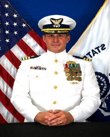 CDR Jason Brand, USCG (Ret.) in military outfit with medals