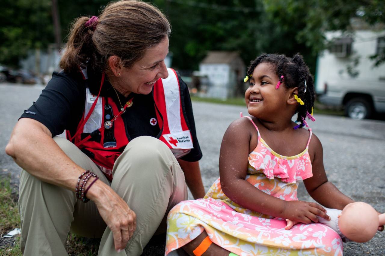 August 22, 2016. Breaux Bridge, St. Martin Parish, Louisiana.
 My goal is to empower children with tools for healing,  says Jodi Bocco (West Long Branch, New Jersey) visits with Karlasia, 5. Bocco is a Red Cross volunteer who provides emotional support to adults and children impacted by disasters.
Photo by: Marko Kokic/American Red Cross