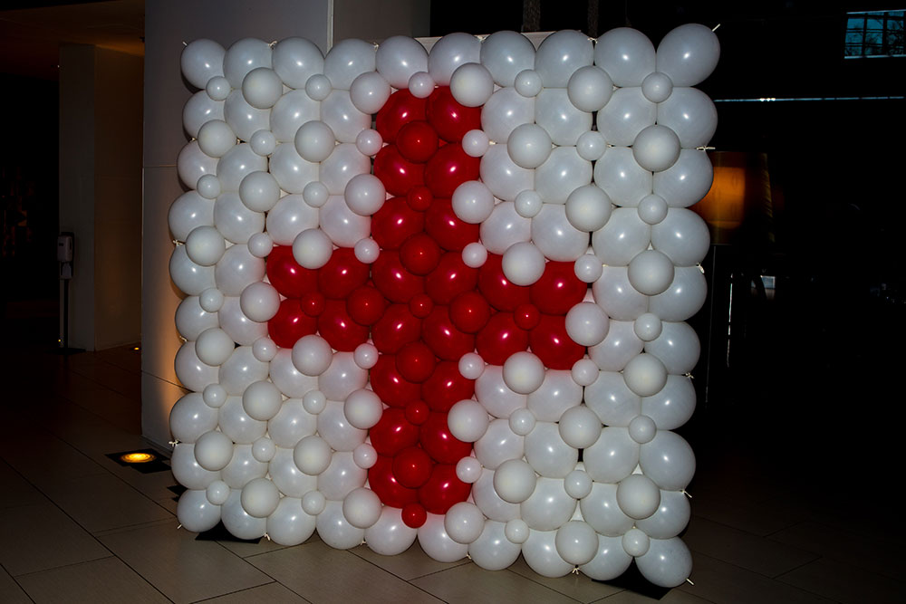 Red Cross logo made out of white and red balloons.