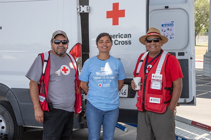 Three Red Cross volunteers representing Hispanic Heritage Month