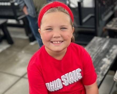 Allie Harris smiling in a red Ohio State shirt