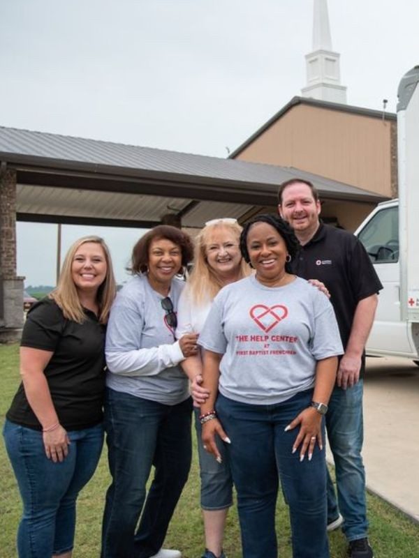 volunteers outside of help center