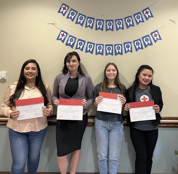 : Recent graduates of the dental assistant training program at Fort Leonard Wood, Missouri, hold their certificates of completion. From left, Ana Valeria Lopez, Elizabeth Hernandez, Adrianna Guzman and Norcel Harvey. (Red Cross photo by Ann Vastmans)