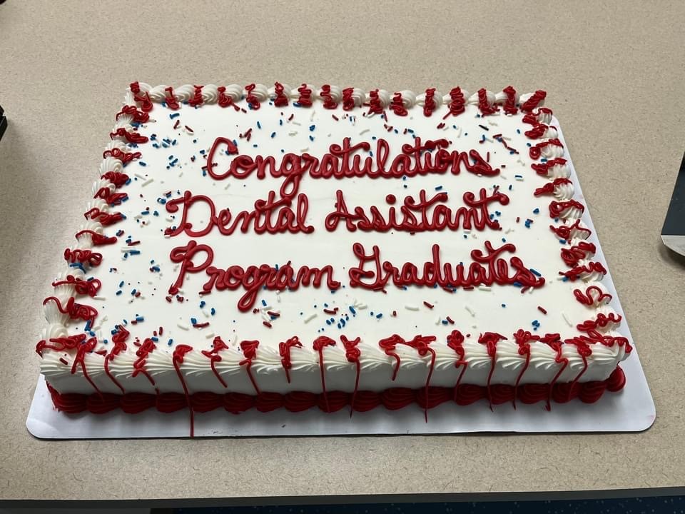 A congratulatory cake for the graduation ceremony at the dental assistant training program at Fort Leonard Wood, Missouri. The program is a partnership between the Red Cross and the military. (Red Cross photo by Ann Vastmans)