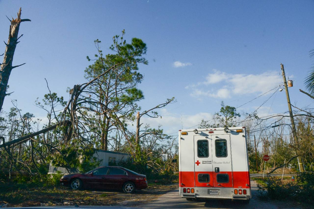 October 14, 2018, Panama City, Florida. American Red Cross emergency vehicles circulated in neighborhoods to provide hot meals, water, and snacks to residents who are still without electrical power or water service due to damage caused by Hurricane Michael. The food was prepared at a mobile kitchen operated by Southern Baptist Disaster Relief and delivered to residents, both in shelters and homes, by Red Cross workers. People receiving the meals repeatedly expressed their thanks in this city where most grocery stores and restaurants are still closed due to storm damage and lack of utility services. 
Photo by Daniel Cima/American Red Cross