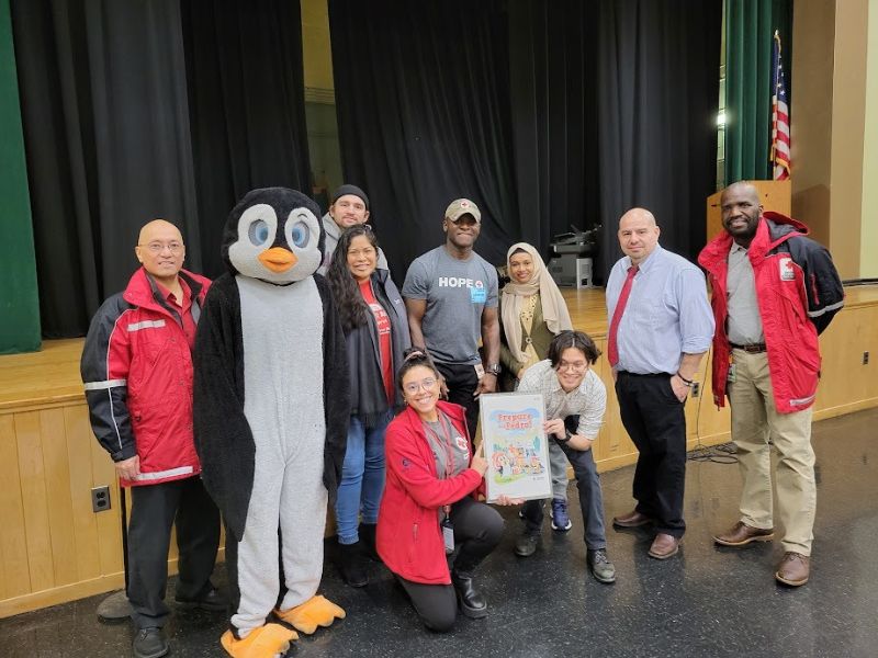 pedro the penguin and volunteers