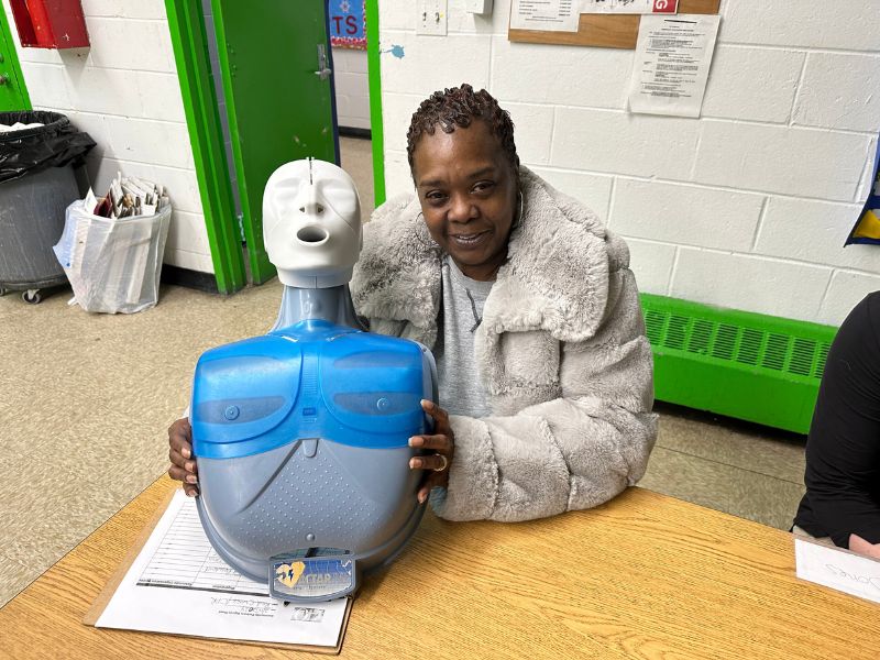 woman with CPR mannequin
