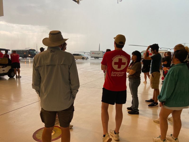 group of red crossers outside 