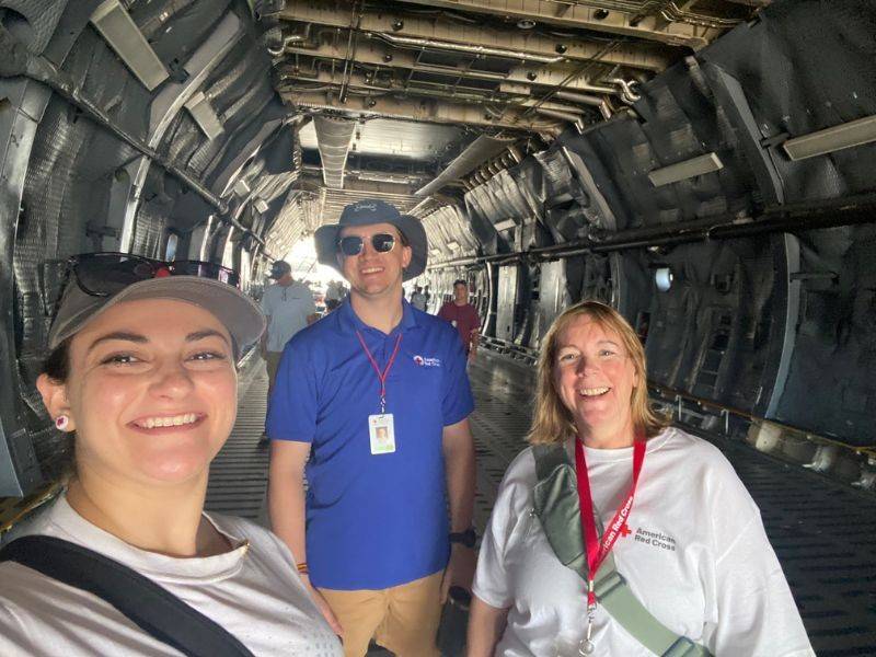 volunteers smilig in aircraft