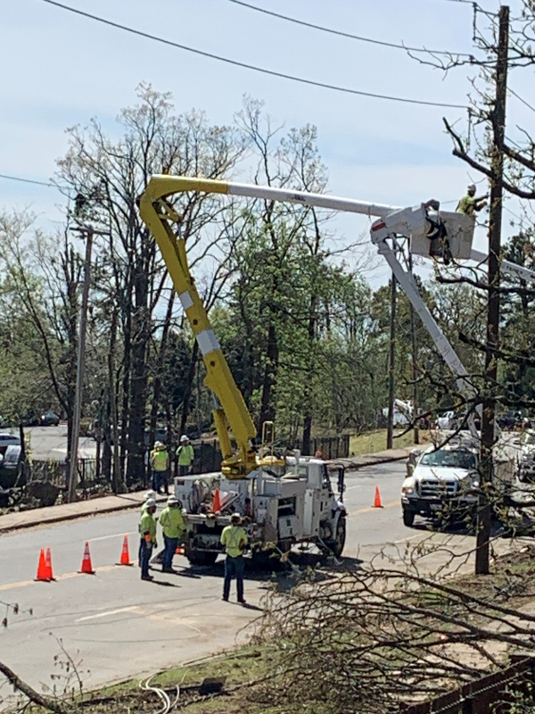 utility workers repairing power lines