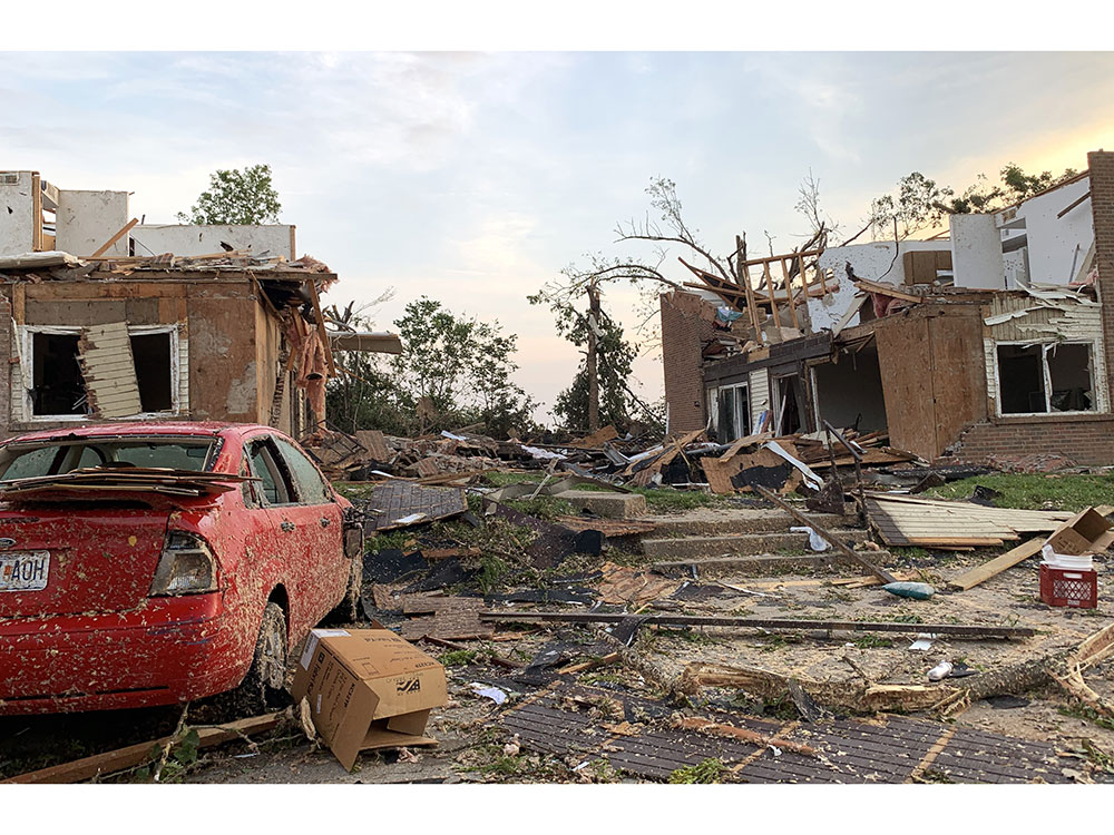 Houses and car damaged by tornado