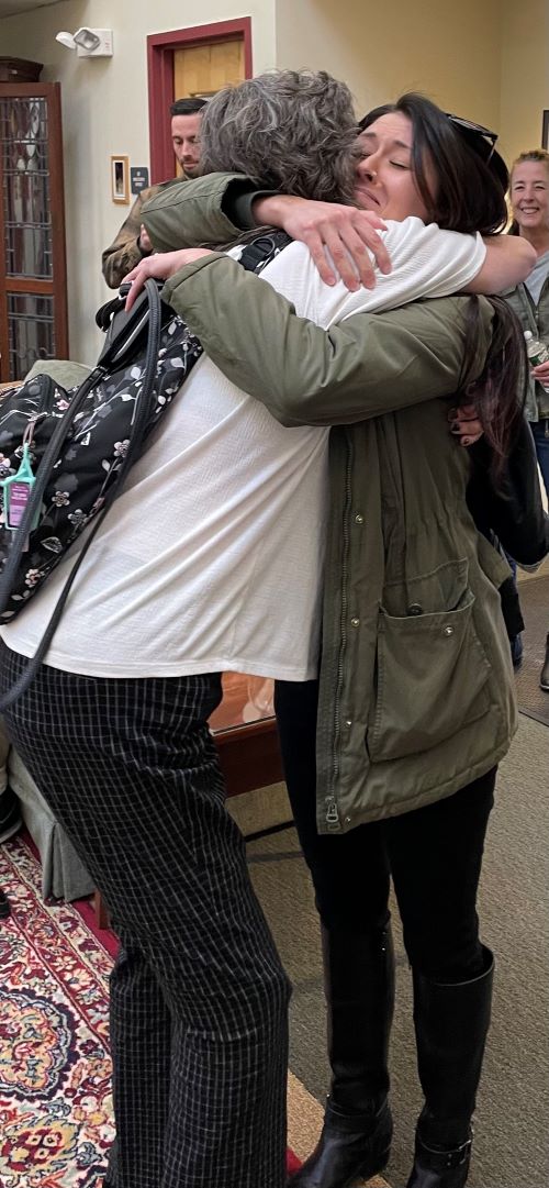 image of two women hugging