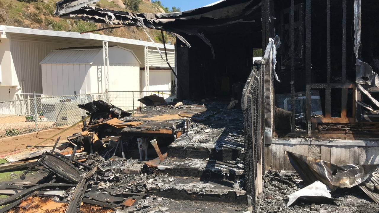 June 10, 2019. Santee, California. Jack and Shirley Reider escaped their burning mobile home with their sweet dog, Zoe, on the morning of May 29, 2019. Less than six months earlier, the American Red Cross had installed free smoke alarms — which sounded when their home caught fire — during a Sound the Alarm home fire safety event held in their mobile home park. 

During the Sound the Alarm event in December 2018, Natalie Lopez, a Red Cross regional philanthropy officer, had reviewed a home fire escape plan with Jack while two volunteers installed three new smoke alarms in the Reiders’ home. In addition, Red Cross volunteers responded to the fire to address the family’s urgent needs by providing immediate financial assistance and one-on-one casework recovery support. The family was also grateful for the support of a volunteer Red Cross nurse, who helped replace prescription medication that was lost in the fire. 

Following the fire, Jack said: “The important thing I take away from this is we were able to get out with our lives and our pup. You can replace things, but you can’t replace a life.”  

He also shared the importance of being prepared to quickly escape: “I was a bomb disposal technician in the military and when you get engaged in fires like this, you don’t have a lot of time. You may think you do — time slows down. In actuality, you better be on your way out the door.” Photo by Emily Cox/American Red Cross

