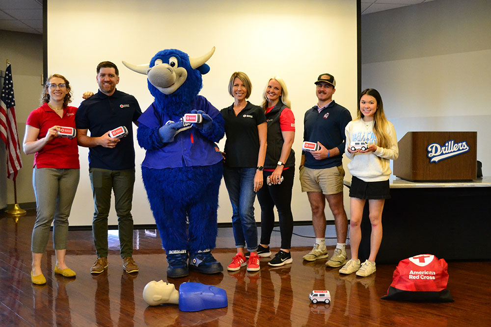 Tulsa Drillers staff, team mascot Hornsby and Red Cross volunteers group picture