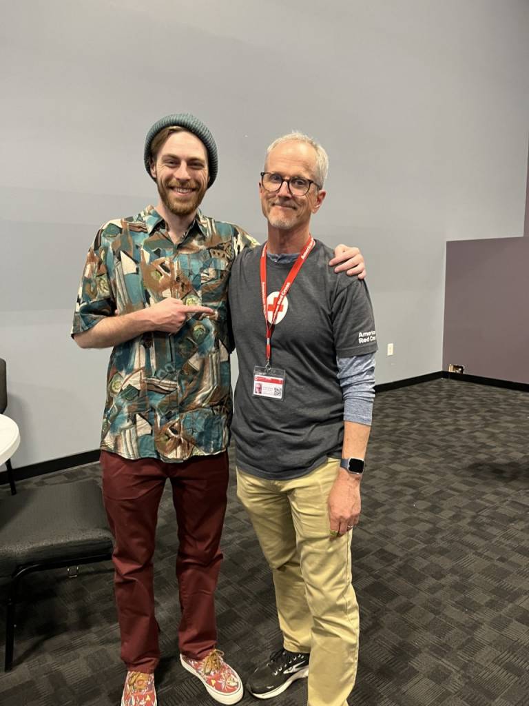 Two men standing next to each other