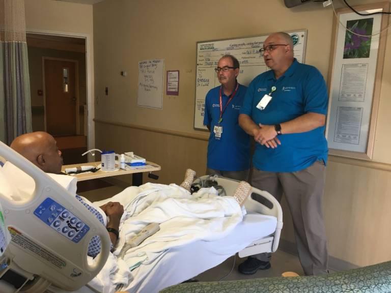 Volunteers visiting a veteran