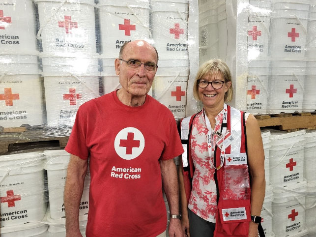 Paul Henke and Suzanne Pehl in a Red Cross emergency warehouse in Conroe