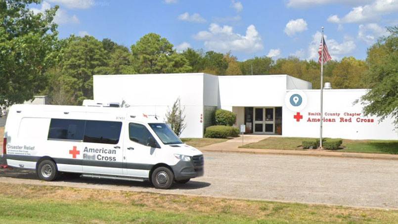 Red Cross Disaster Relief van parked in front of Smith County Chapter Red Cross building.