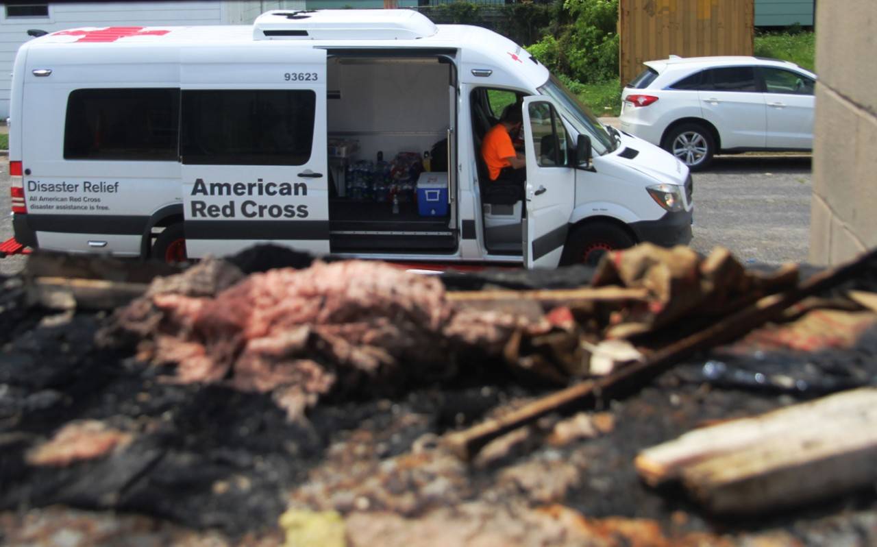 June 27, 2018.
New Orleans, Louisiana.
Home Fire

Pictured: Red Cross van and fire damage 

The American Red Cross responds to tens of thousands of home and apartment fires every year. A fire in this apartment complex in Orleans Parish, Louisiana, severely damaged the building and injured at least one resident. Red Cross Disaster Action Team volunteers responded immediately, offering support and assistance to all residents who were displaced by the fire.

Photo by Greg Roques for the American Red Cross.