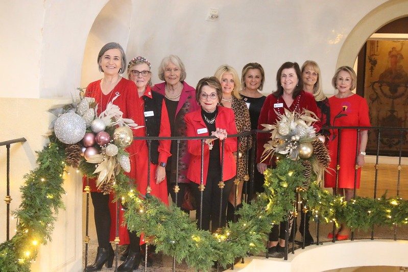 Group pic of Tiffany Circle members with holiday decorations at Dallas Holiday Luncheon 2023.