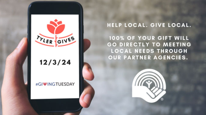 Hand holding smart phone with Tyler Gives, 12/3/24 and #GIVINGTUESDAY written on it.