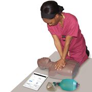 Student learning CPR with the Brayden/OBI Adult CPR Manikin with LED Red Light CPR Feedback, Brown.